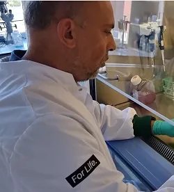 E. van den Akker in the lab